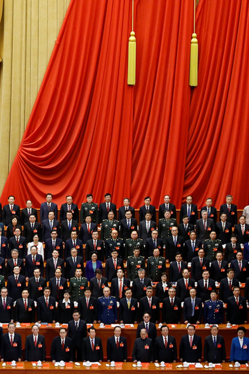 <p>Xi Jinping stands before delegates during the nineteenth National Congress in 2017.</p>