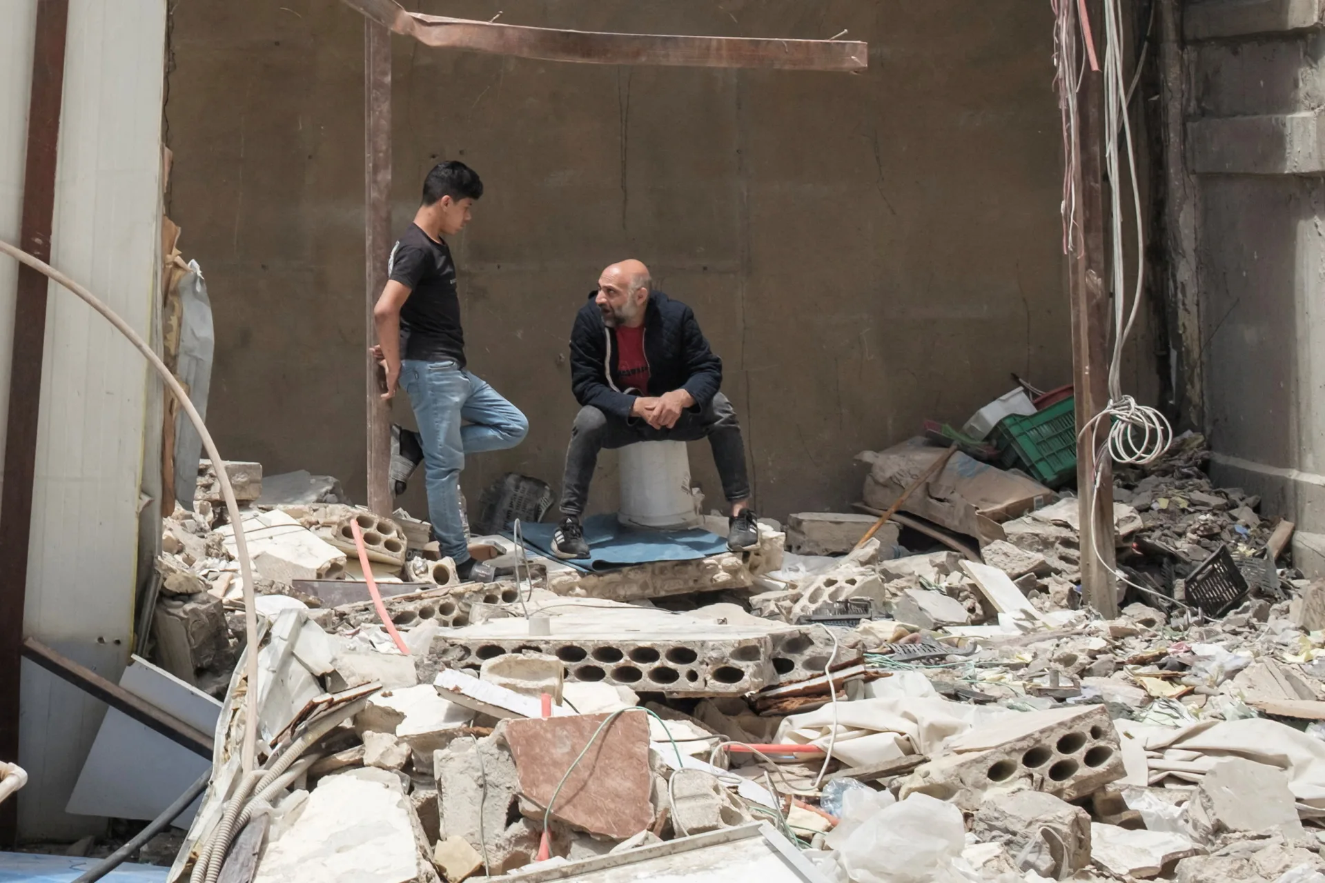 <p>People inside a destroyed building, amid a temporary ceasefire between Lebanon and Israel, in Tyre, southern Lebanon, April 28, 2026.</p>