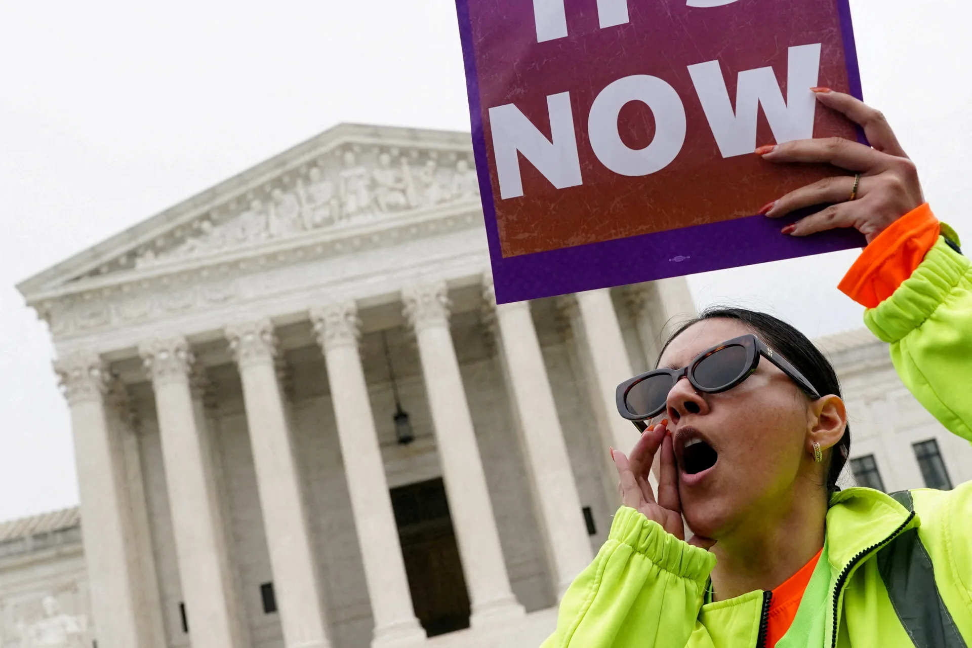 <p>A woman holds a placard as immigrants’ rights activists and demonstrators attend a rally outside the U.S. Supreme Court in Washington, D.C., on April 29, 2026.</p>