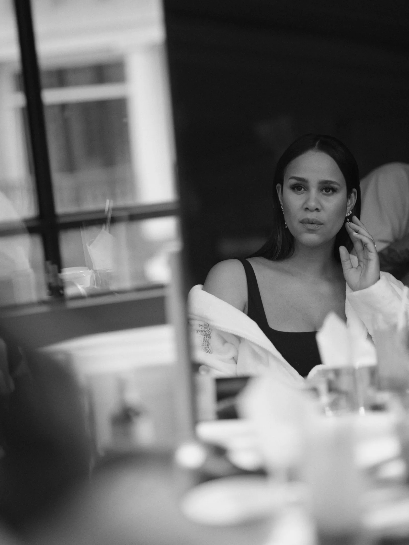 Image may contain Zawe Ashton Body Part Finger Hand Person Adult Face Head Photography Portrait and Indoors