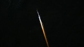 NASA astronaut Chris Williams photographed this fireball — likely caused by reentering orbital debris — from the International Space Station on April 27, 2026.