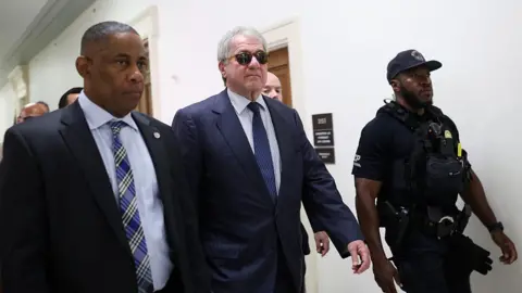 Former CEO of Apollo Global Management Leon Black (C) arrives to testify at a closed-door interview with the House Oversight Committee on Capitol Hill on June 26, 2026 in Washington, DC. 