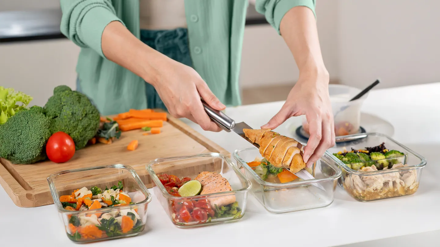 Woman meal prepping in kitchen