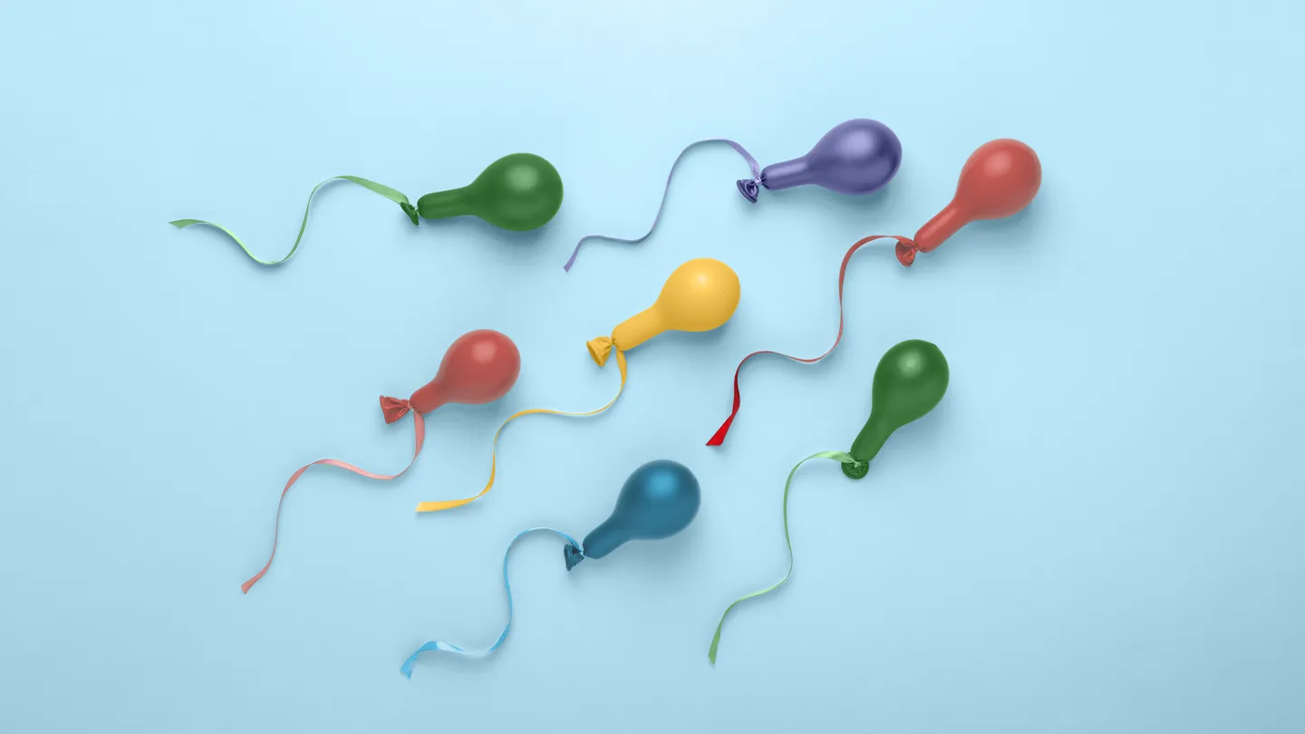 colorful balloons shaped like sperm swimming