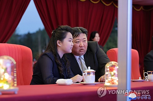 This file image, provided by North Korea's official Korean Central News Agency on May 15, 2024, shows North Korean leader Kim Jong-un (R) and his daughter, known by the name Ju-ae. (For Use Only in the Republic of Korea. No Redistribution) (Yonhap)