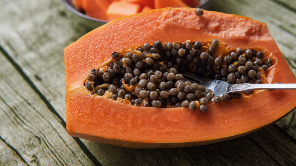A papaya fruit cut in half. -1